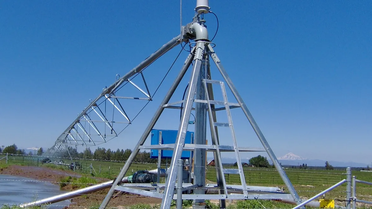 Center pivot end hub structure against sky