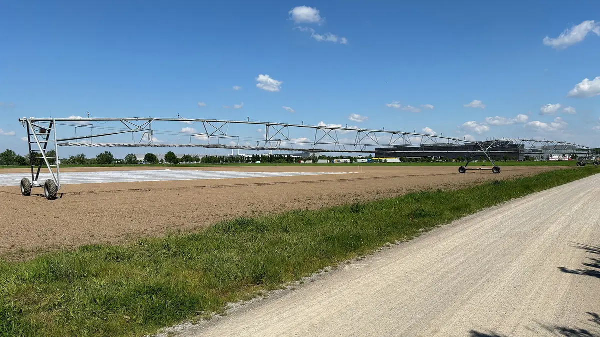 Center pivot irrigation system along a gravel road