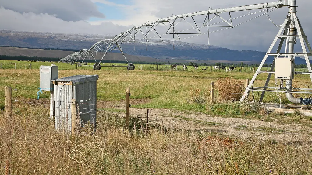 Center pivot irrigation truss and control house on farmland